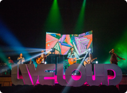 Group of people on stage with instruments